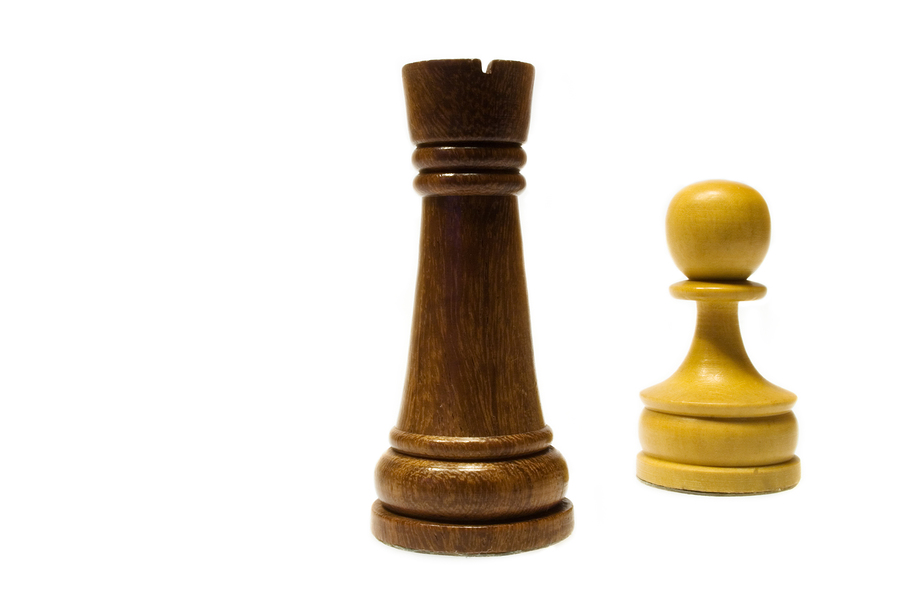 Tall and small chess pieces