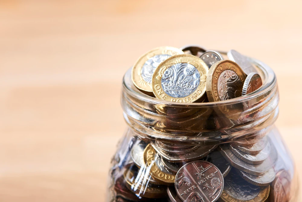 Money pot of pound coins
